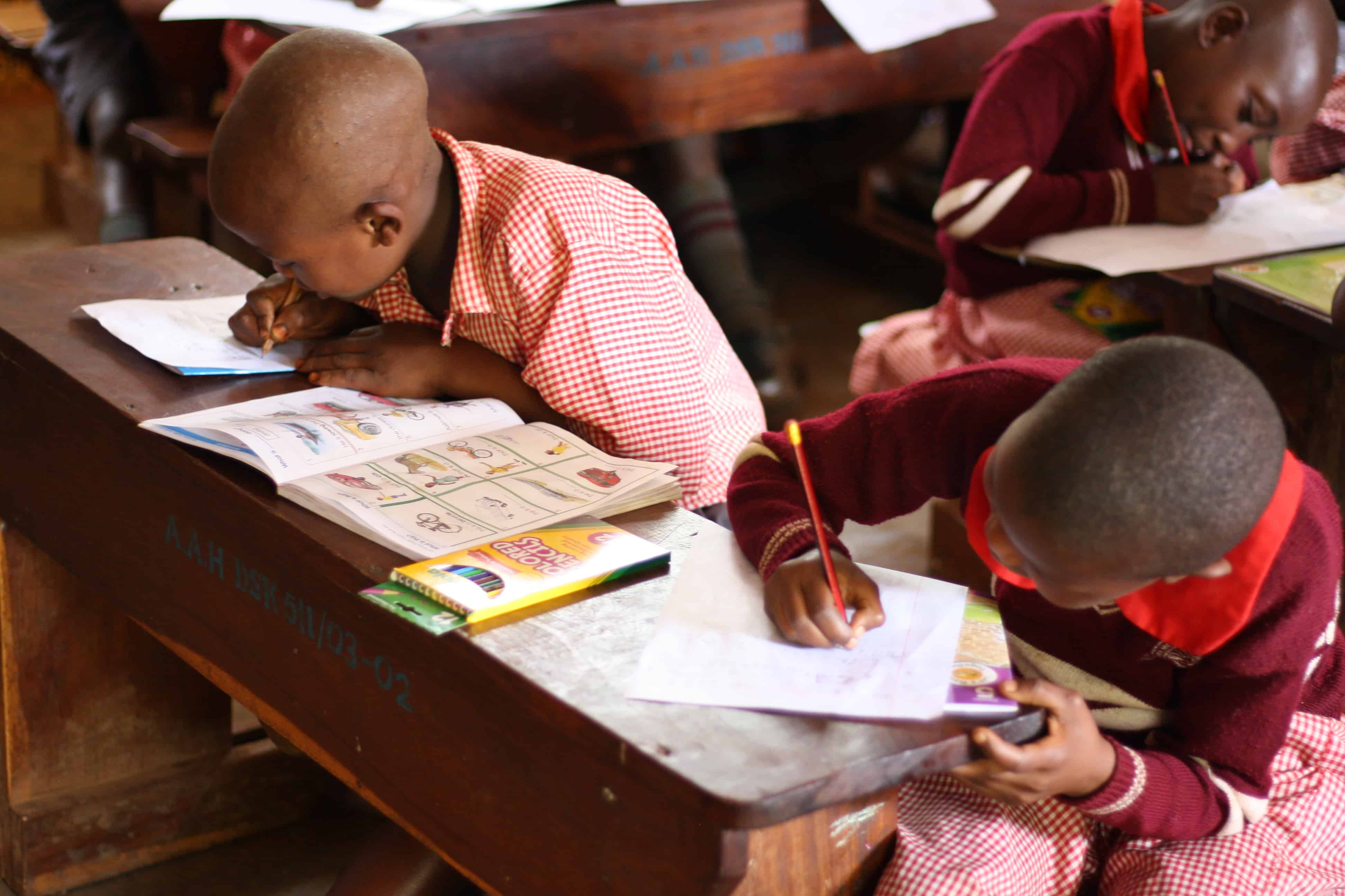 p1 students in class at REACH for Uganda