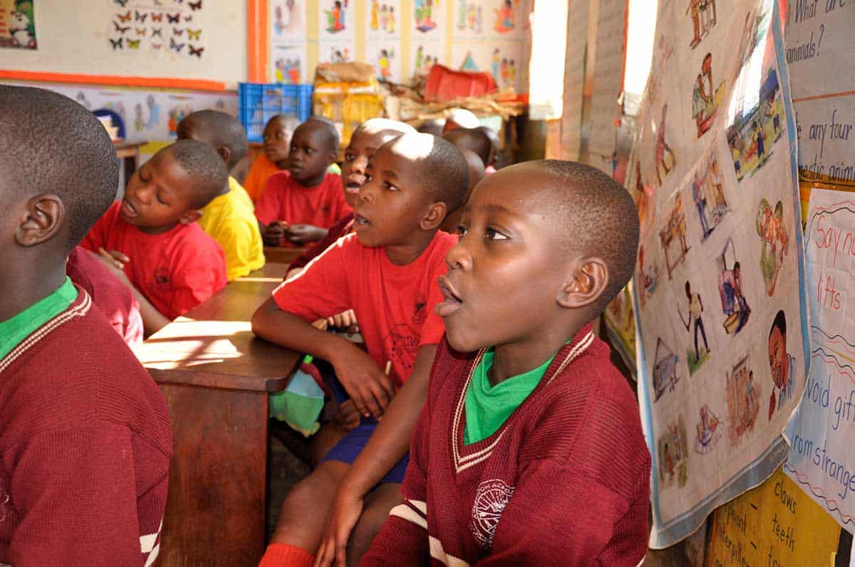 children at school at REACH Uganda