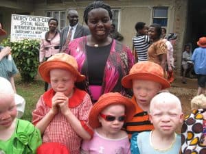 Joyce Wanda with kids at albinism workshop