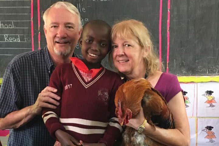 sponsors with student in uganda